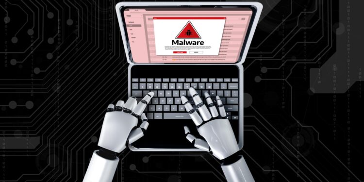 Robot elleri dizüstü bilgisayarda malware uyarısı ekranına yazı yazıyor.